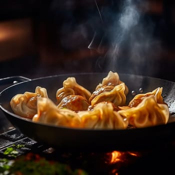 Grilled dumplings gyoza with meat in bamboo steamer with soy sauce on the side