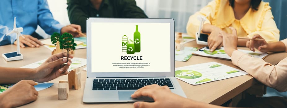 Recycle packaging displayed on laptop at a green business meeting while business team presenting green design. ESG environment social governance and Eco conservative concept. Closeup. Delineation.