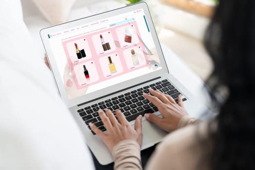 Woman shopping online on internet marketplace browsing for sale items for modern lifestyle and use credit card for online payment from wallet protected by crucial cyber security software