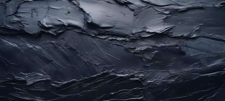 Dark slate texture with rough, uneven surface and layers.
