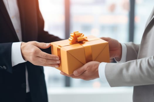 Close up view of hands Giving a business gift in an office.