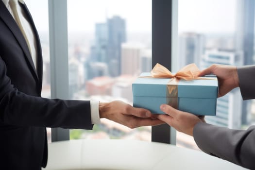 Close-up view of hands Giving a business gift in an office.