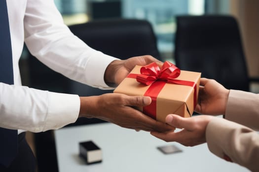 Close up view of hands Giving a business gift in an office.