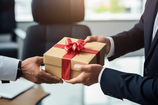 Close up view of hands Giving a business gift in an office.