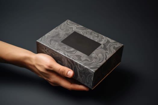a hand holding a mailing box mockup delivery service concept photo.