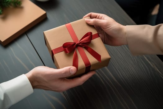 Close up view of hands Giving a business gift in an office.