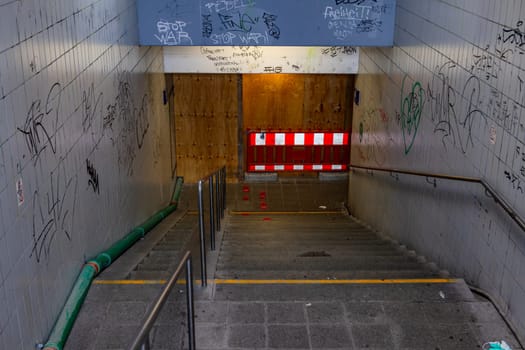 Fully lubricated walls at an exit with stairs at an underpass at a train station