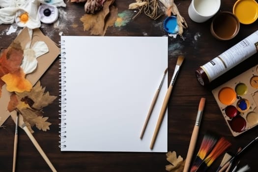A white sheet of paper on a table with art supplies, top view, Generative AI.