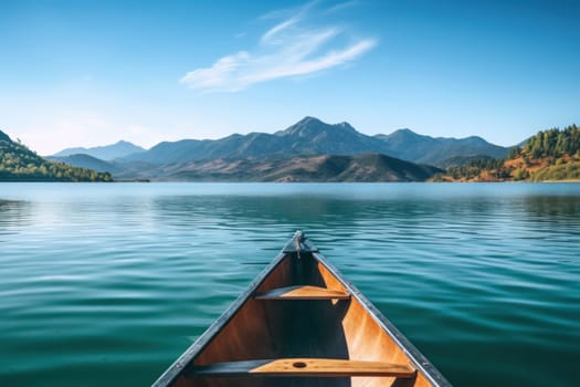 Canoe in the middle of the lake, mountains and clear sky background.