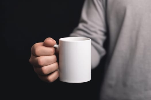 Closeup of hand holding of white mug or cup isolated Generative AI.