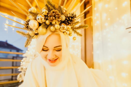 A woman in a white dress is holding a gold box with a red ribbon. She is wearing a crown on her head. The scene takes place in a room with a door and a window. The woman appears to be opening the gift box.