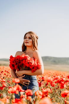 Woman poppies field. portrait of a happy woman with long hair in a poppy field and enjoying the beauty of nature in a warm summer day