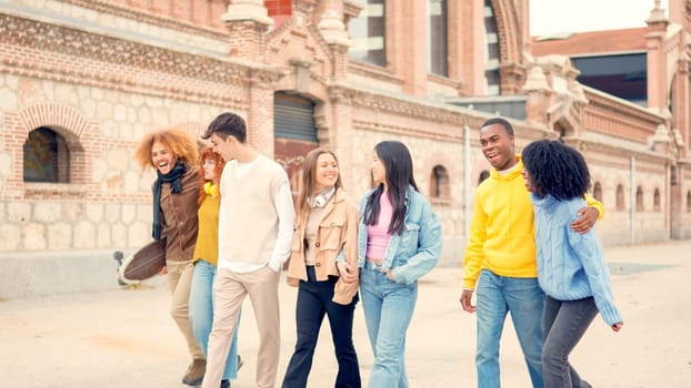 Group of multi-ethnic friends strolling together relaxed in the city