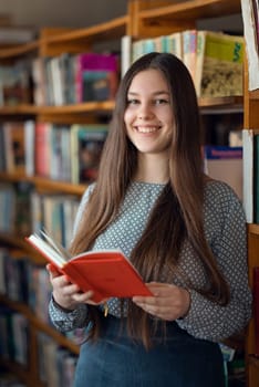 Portrait of cheerful girl in university library