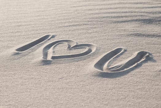 Love between people, romantic message on beach sand to a loved one