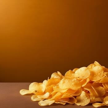 Potato chips junk food on a yellow background.