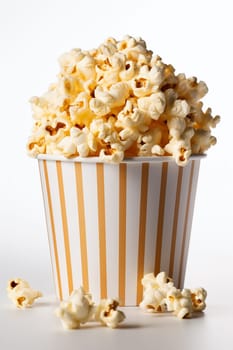 A full box of popcorn perfect snack for cinema on a yellow background.