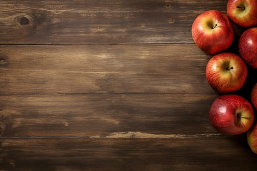 Fresh red apples on rustic wooden background