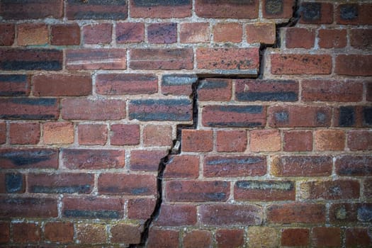 A Large Crack In An Old Red Brick Wall