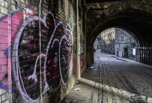 Edinburgh, Scotland-Jan 17, 2024 - View of tunnel under South Bridge on Cowgate street in Edinburgh, The capital of Scotland. Space for text, Selective focus.