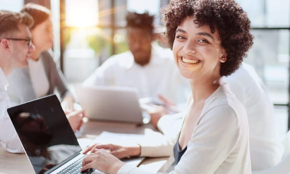 Face of beautiful woman on the background of business people