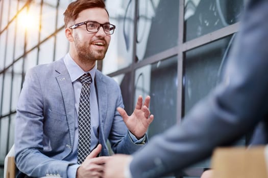 Two diverse business men analysts partners talking, working together
