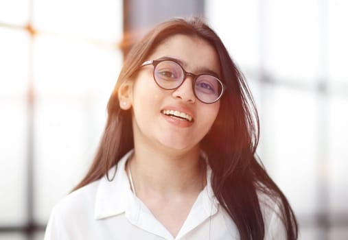 head shot portrait of a preppy, young, beautiful, confident and attractive woman