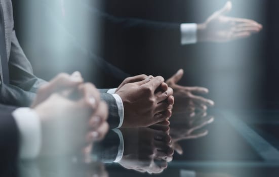 Cropped shot of unrecognizable people, male hands of business people on the table close-up