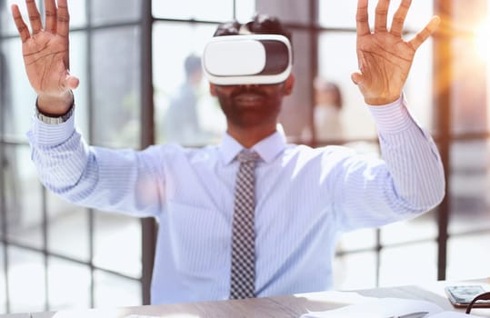 European man office employee wears formal suit and VR headset glasses excited of experiencing virtual reality