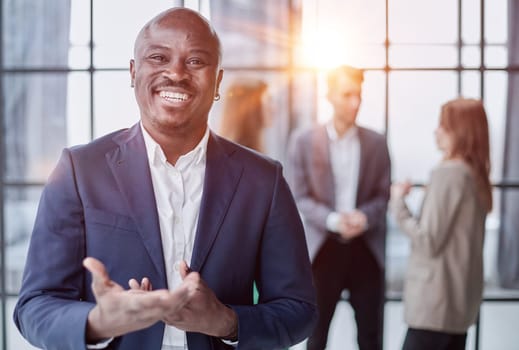 Handsome african american executive businessman in the office close up