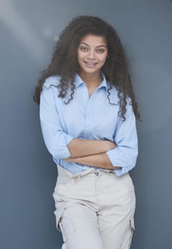 Photo of cheerful self-assured lady folded arms wear blue shirt grey color background