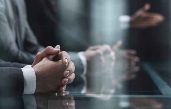 Cropped shot of unrecognizable people, male hands of business people on the table close-up