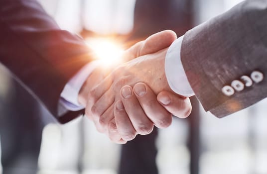 Business partnership meeting concept. Image businessmans handshake. Successful businessmen handshaking after good deal.