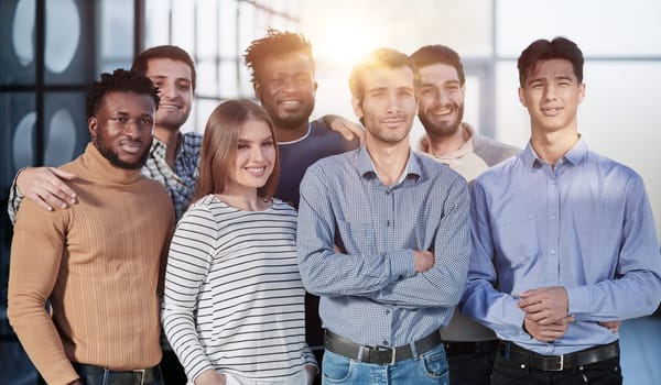 Everybody brings a different skill to the team. Portrait of a diverse group of coworkers standing in an office.