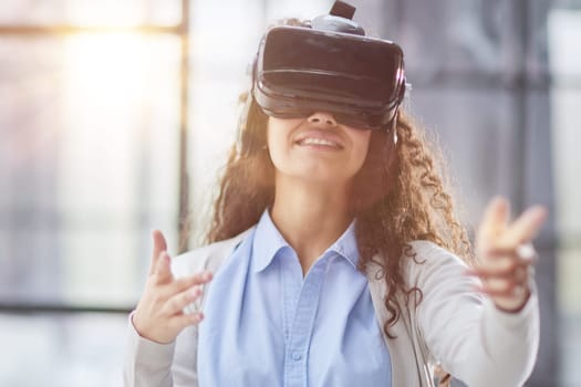 Girl trying to touch objects in virtual reality.