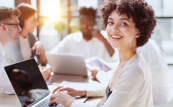 Face of beautiful woman on the background of business people