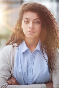 girl standing at modern office looking at camera