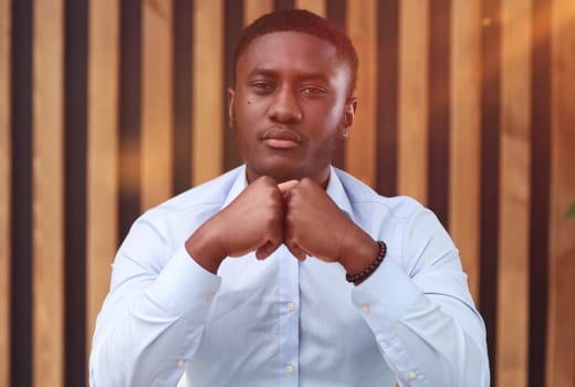 Portrait of a confident senior man businessman, accountant, manager sitting in the office at the table