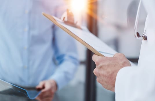 male doctor with a folder in uniform