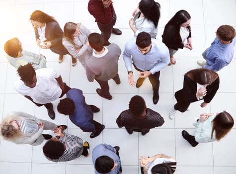 Young people in the conference room communicate top view