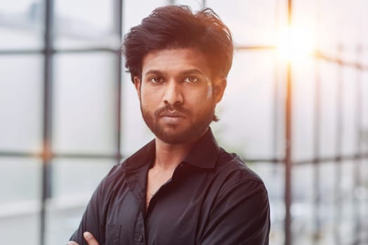 Confidence and business concept. Portrait of charming successful young entrepreneur
