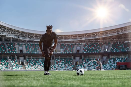 African American soccer player kicking ball during match