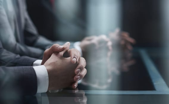 Cropped shot of unrecognizable people, male hands of business people on the table close-up