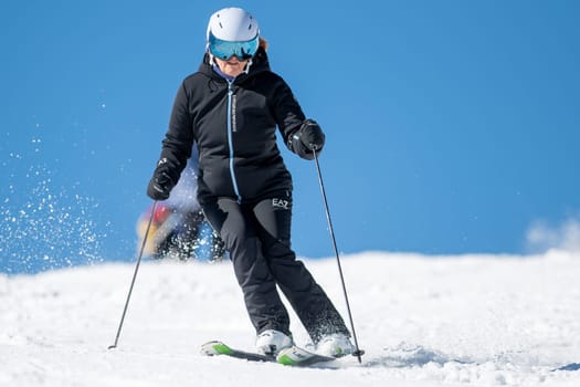 Grandvalira, Andorra: 2024 February 5 : Woman skiing on the slopes of Grandvalira in Andorra in the winter of 2024.