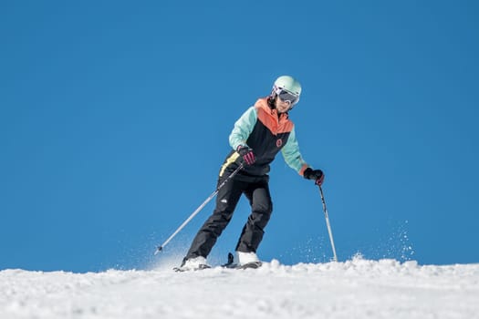 Grandvalira, Andorra: 2024 February 5 : Woman skiing on the slopes of Grandvalira in Andorra in the winter of 2024.