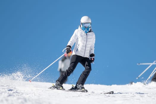 Grandvalira, Andorra: 2024 February 5 : Woman skiing on the slopes of Grandvalira in Andorra in the winter of 2024.