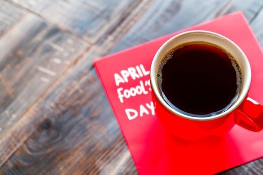 April fool's day with coffee red mug background .Ai generative.