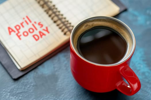 April fool's day with coffee red mug background .Ai generative.