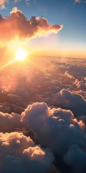 An aerial perspective of a breathtaking sunrise illuminating the fluffy texture of clouds from above.