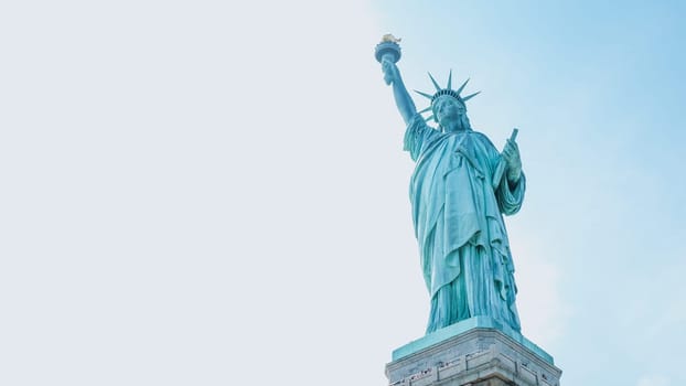 The Statue of Liberty, New York City on sunny blue sky. American symbol. Memorial day, Patriot Day. Space for text. New York NY USA 2023-07-30.